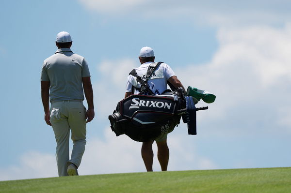 Brooks Koepka with caddie Ricky Elliot