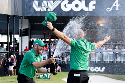 Louis Oosthuizen celebrates with Dean Burmester on LIV Golf