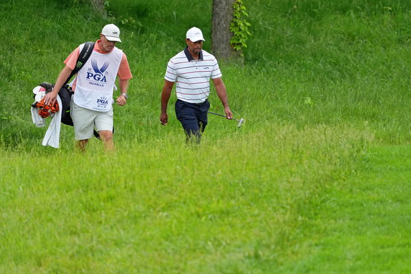 Lance Bennett with Tiger Woods