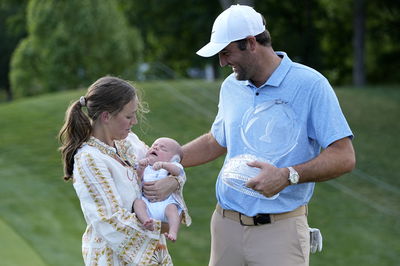 Scottie Scheffler with his wife and son