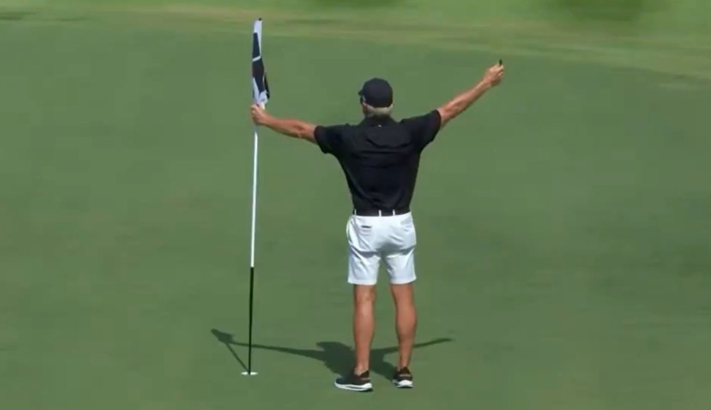 Greg Norman tended the pin