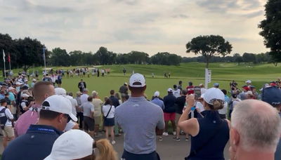 Tiger Woods watches his son Charlie Woods 