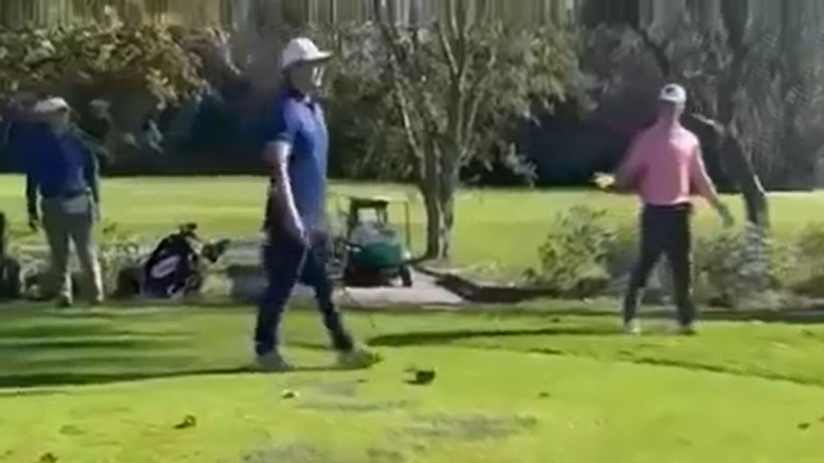 A golfer smashed his driver over a player's head