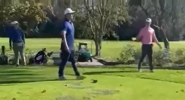 A golfer smashed his driver over a player's head