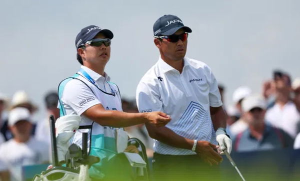 Hideki Matsuyama with his caddie