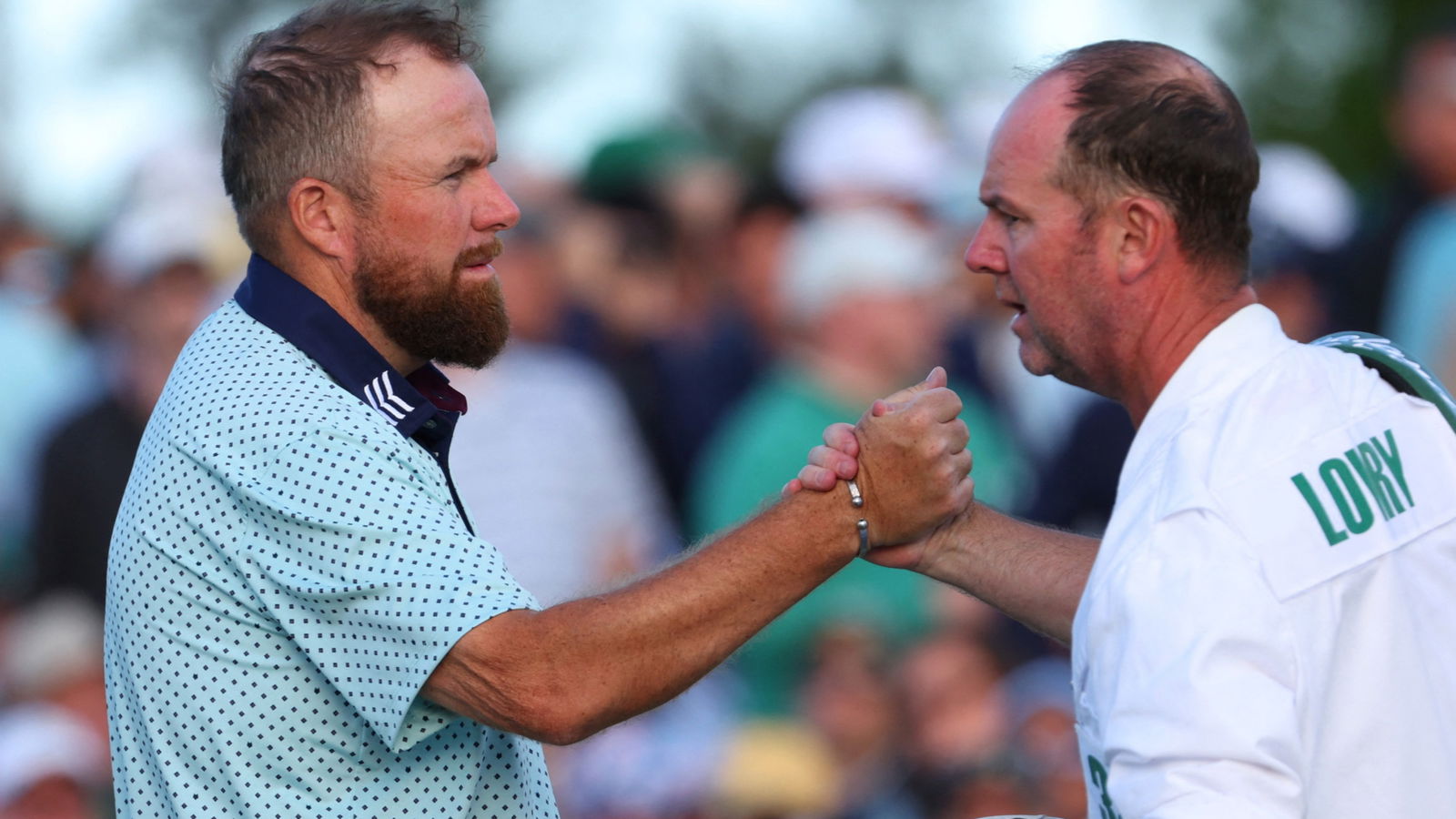 Shane Lowry and his caddie
