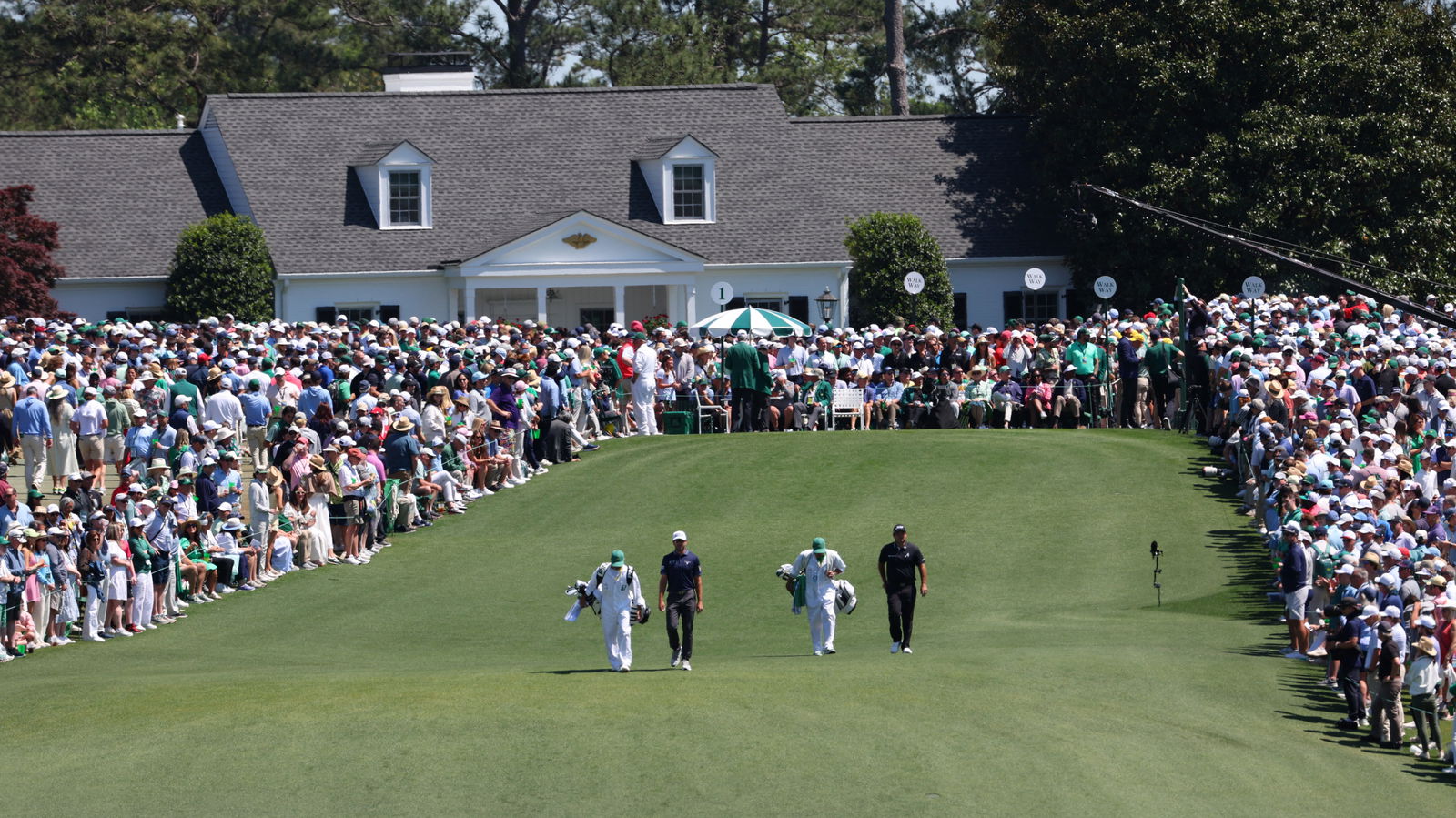 Patrick Reed and Corey Conners at the 2025 Masters