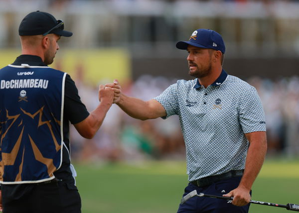 Bryson DeChambeau with his caddie Greg Bodine