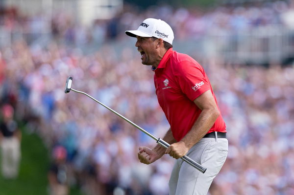 Keegan Bradley reacts after a birdie putt on the 18th hole to win the Travelers Championship golf tournament