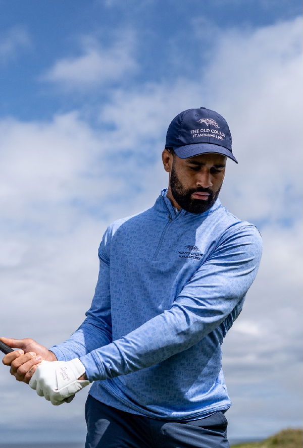 Golfer wearing branded cap