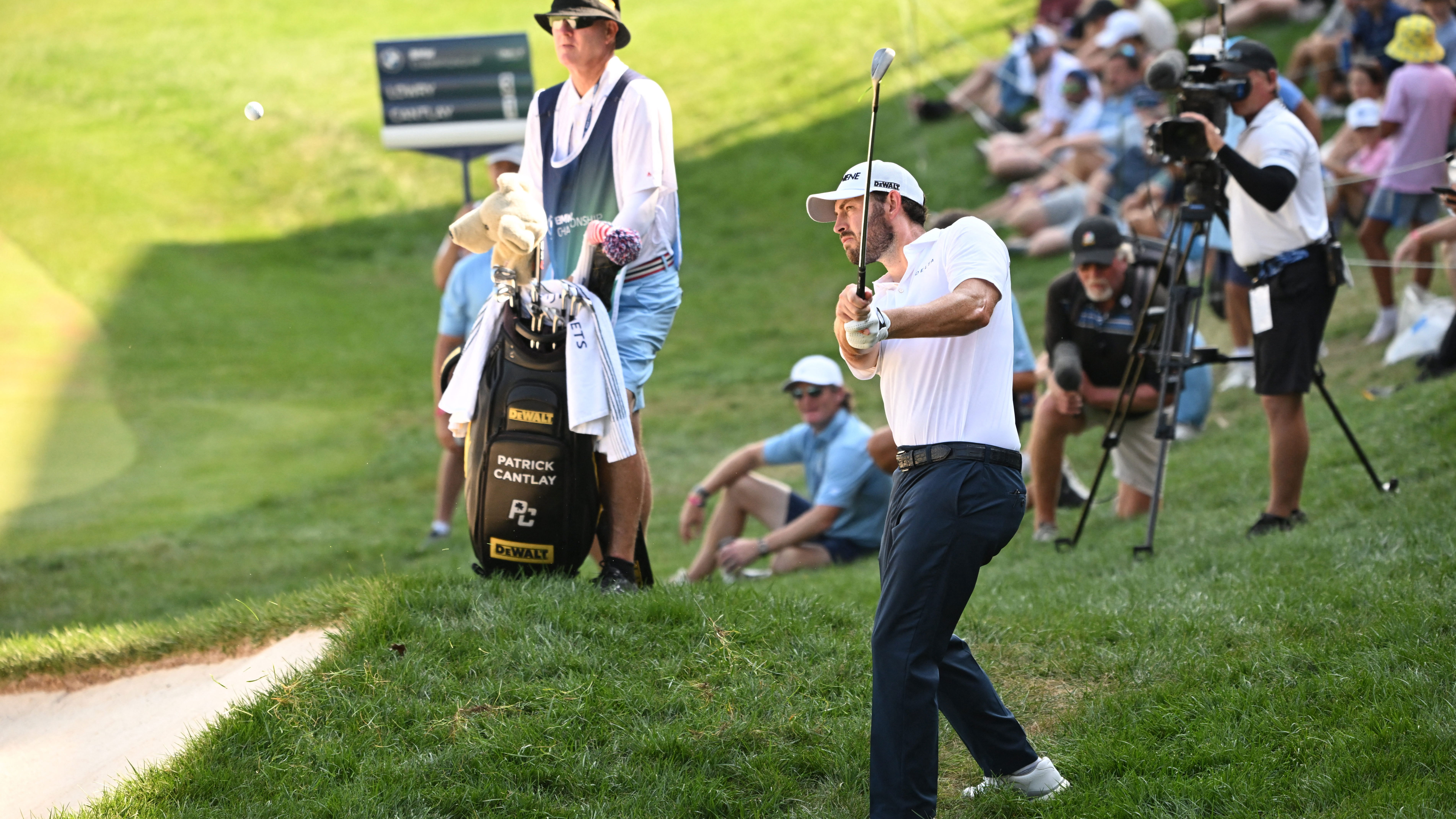 Patrick Cantlay hits a shot out of the rough on the 18th hole during the third round of the BMW Championship