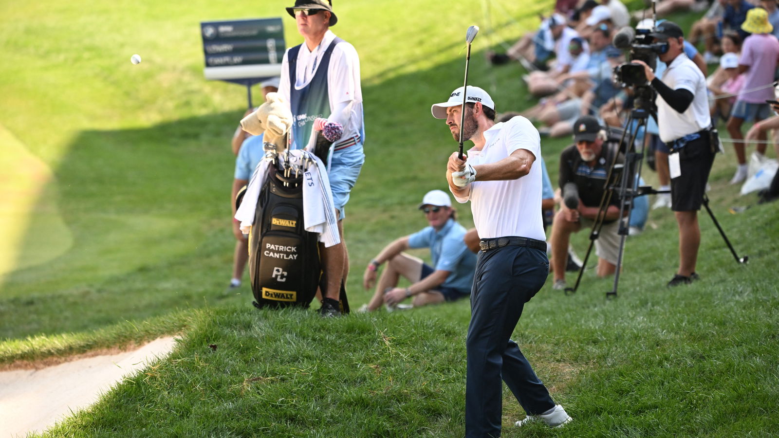 Patrick Cantlay hits a shot out of the rough on the 18th hole during the third round of the BMW Championship