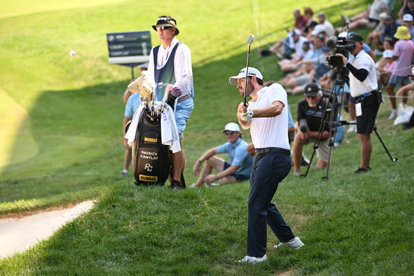 Patrick Cantlay hits a shot out of the rough on the 18th hole during the third round of the BMW Championship