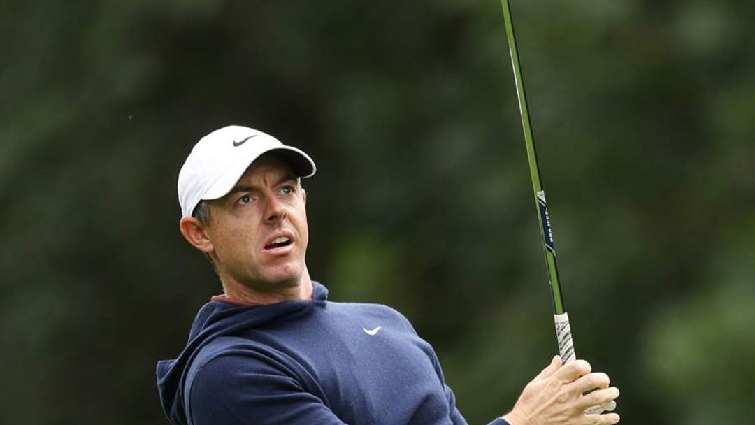McIlroy plays a shot with his new TaylorMade MG5 wedges