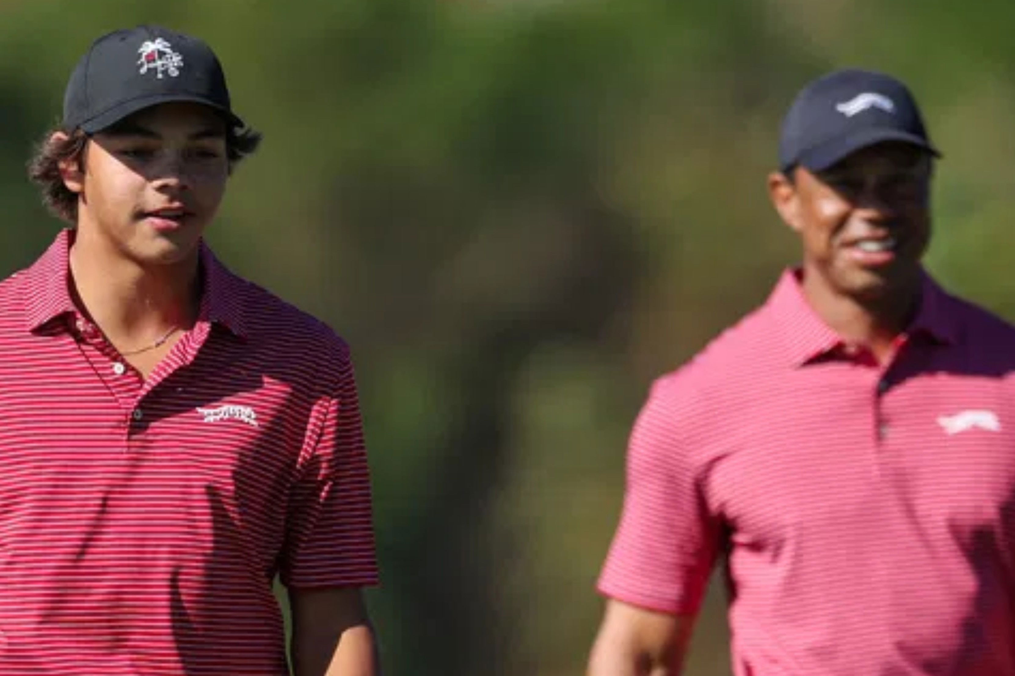 Charlie Woods with father Tiger Woods