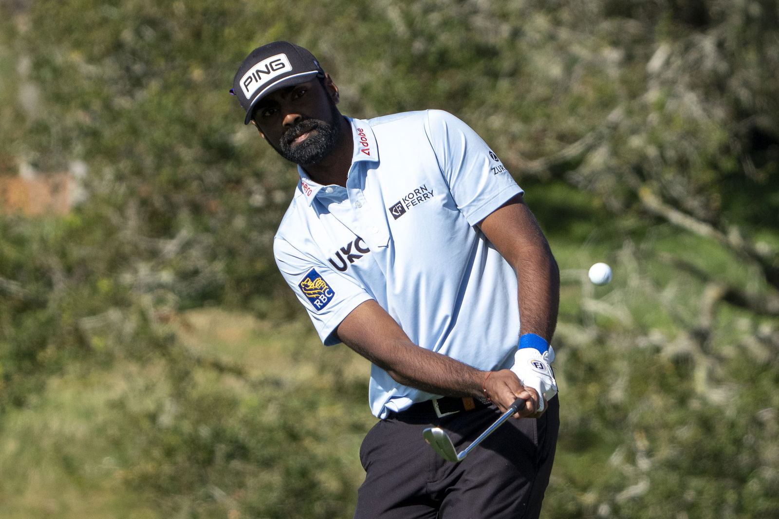 Sahith Theegala hits his chip shot on the second hole during the first round of the AT&T Pebble Beach Pro-Am