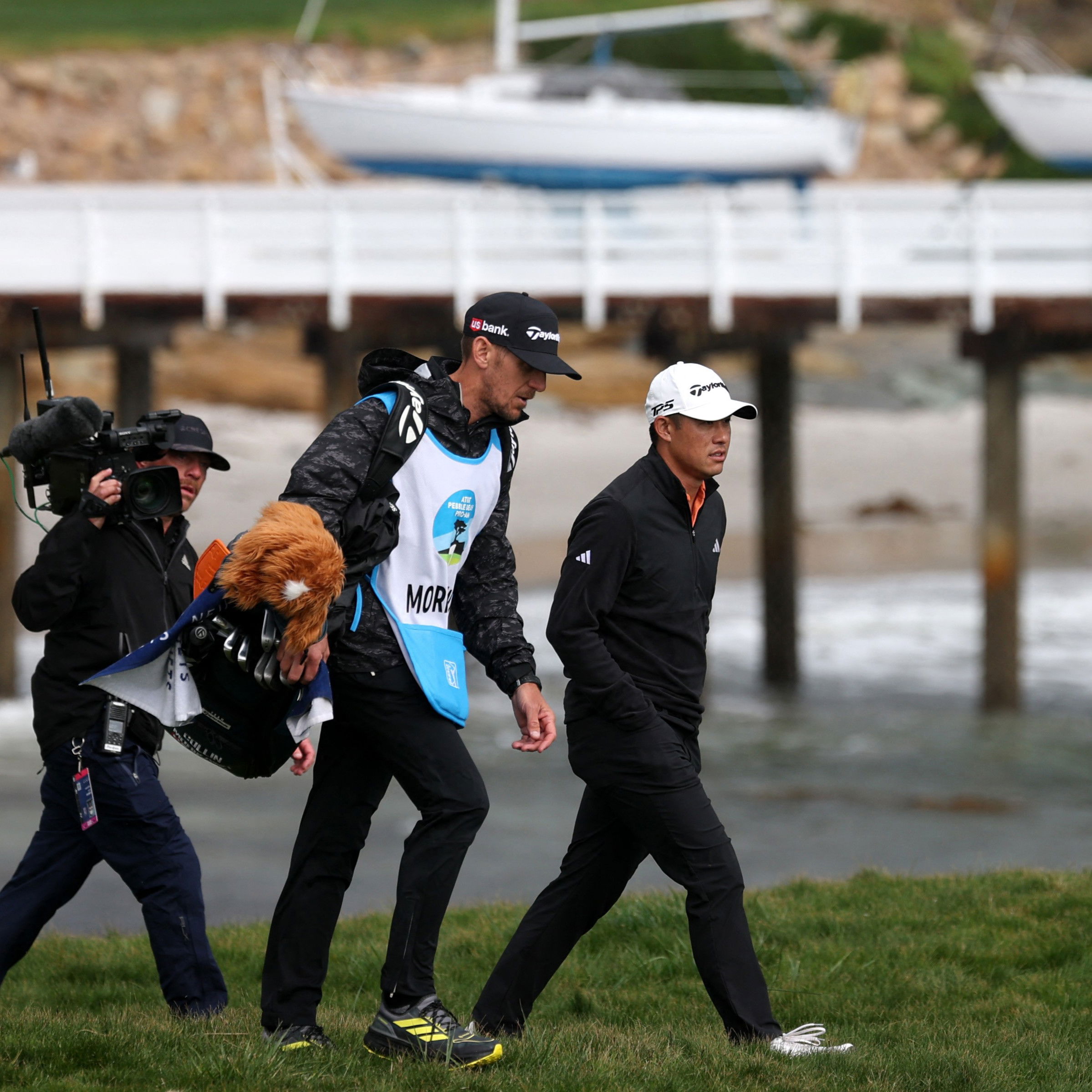 Collin Morikawa and his caddie