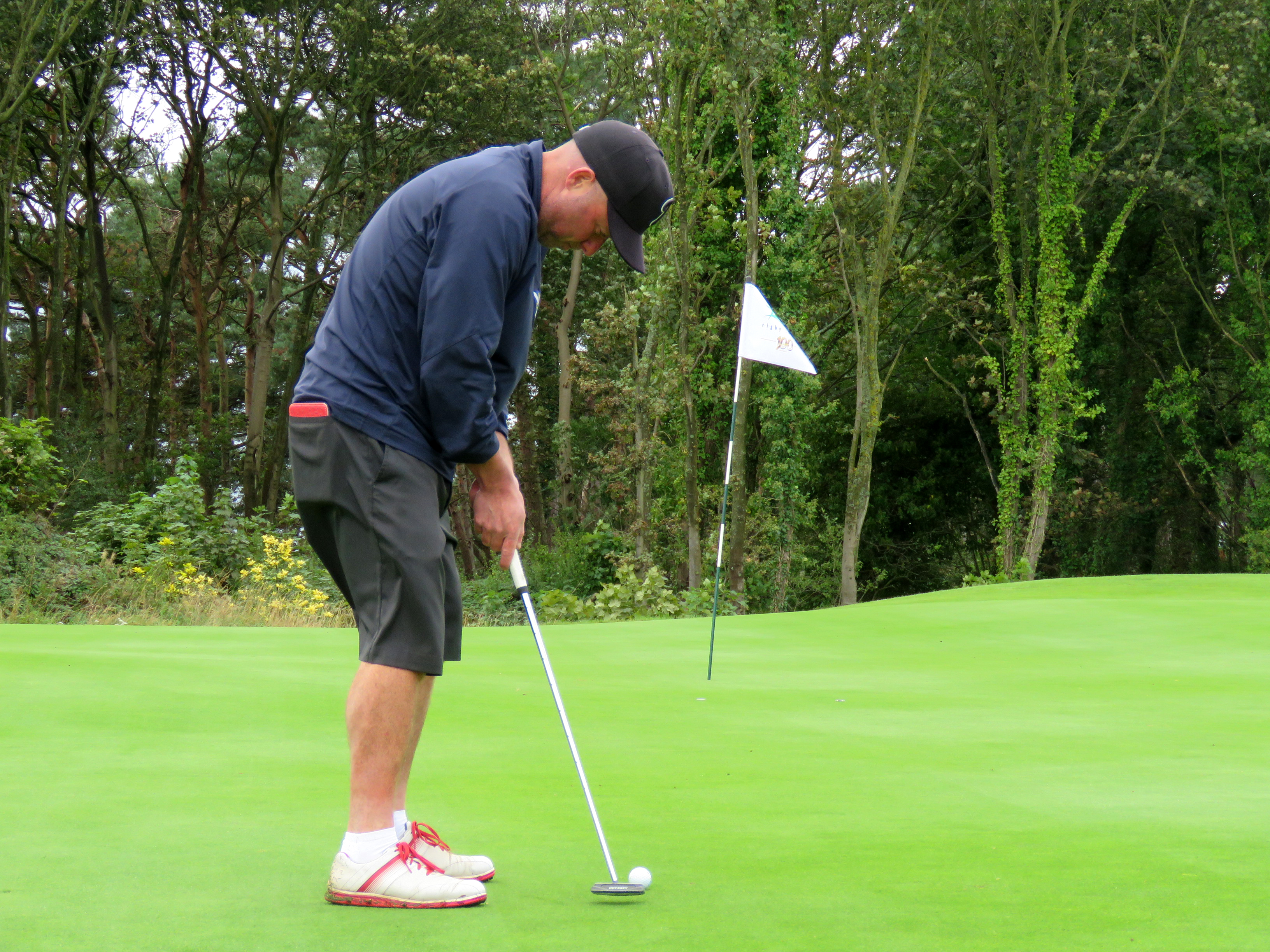 Golf course manager on golfers putting with flag in: It's a gimmick!