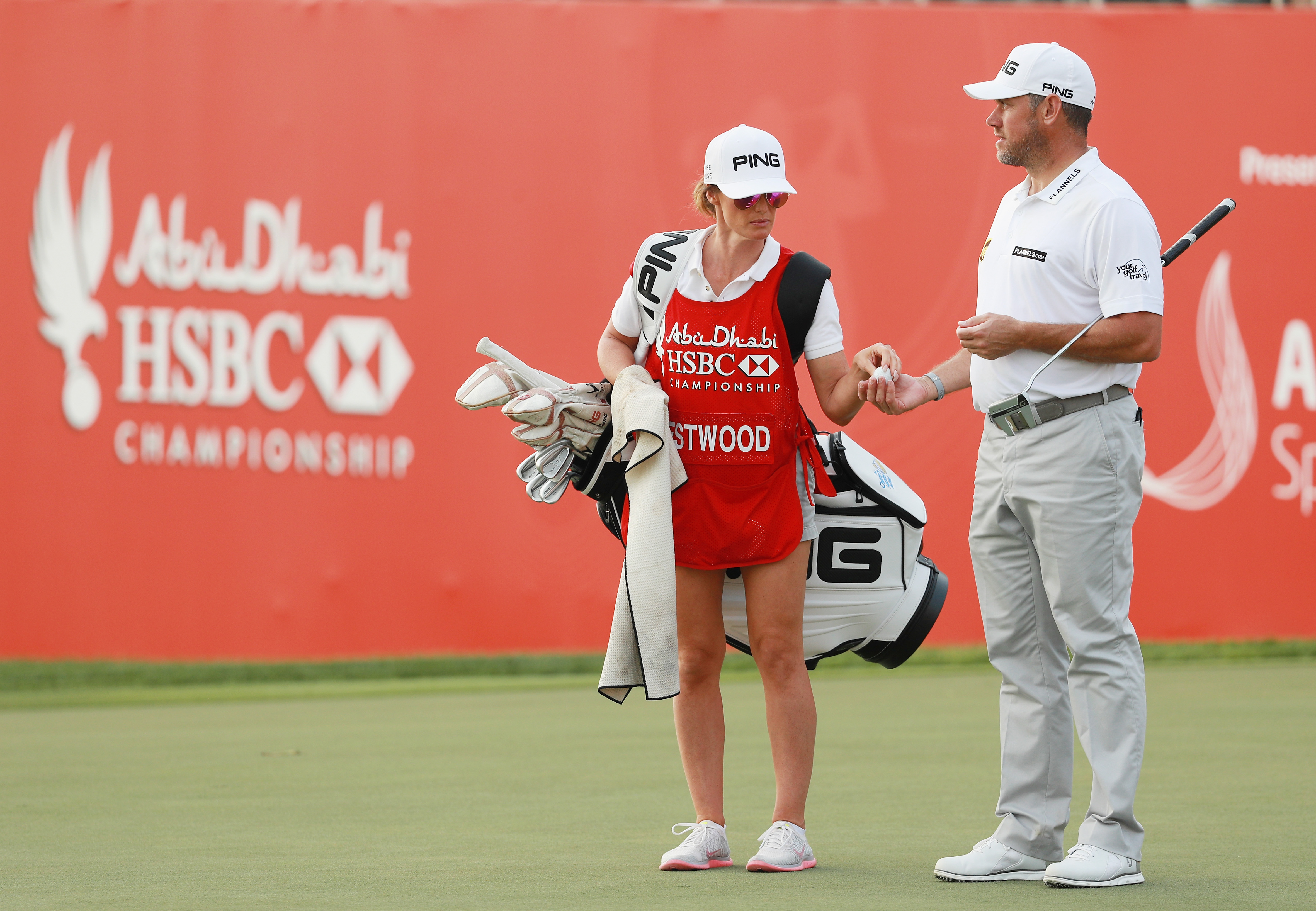 Westwood's girlfriend stands in as caddy in Abu Dhabi