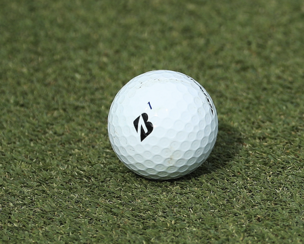 #13 - How does Tiger Woods mark his golf ball