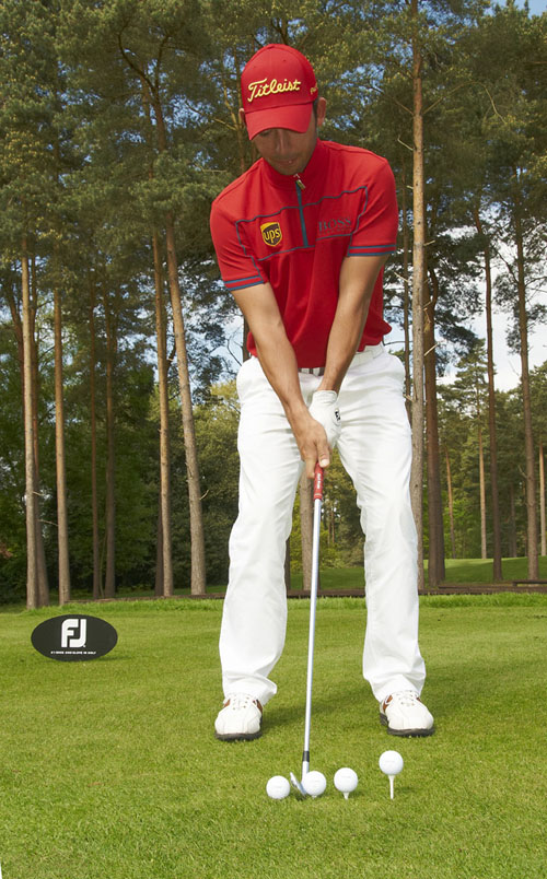 Larrazabal identifies the four ball positions using his 6-iron to show the centre of his stance