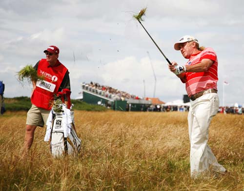 Spot the divot: Looks like Miguel's caddie's carrying it!