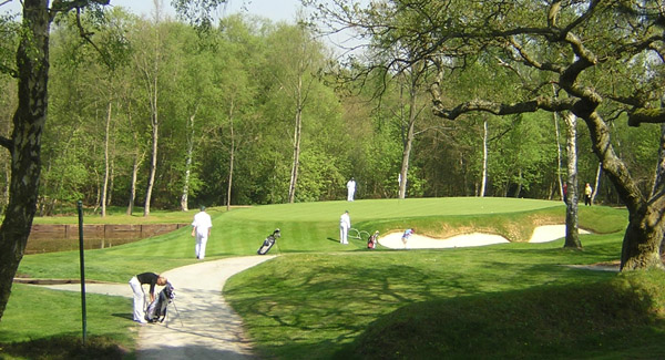 Caddies in action at Wentworth's newly re-shaped 8th green