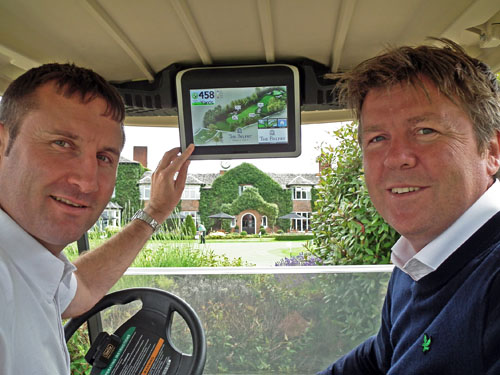 Gary (left) and Phil demonstrate the Visage GPS mobile golf information system, fitted to each Club Car in the fleet.