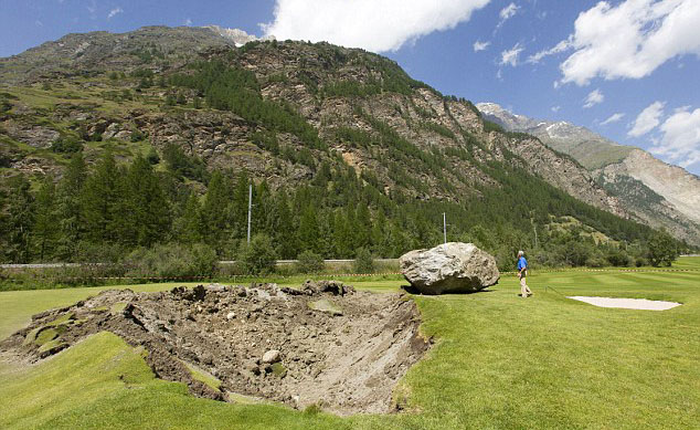 FORE! Rock falls 1,000 feet onto Swiss course