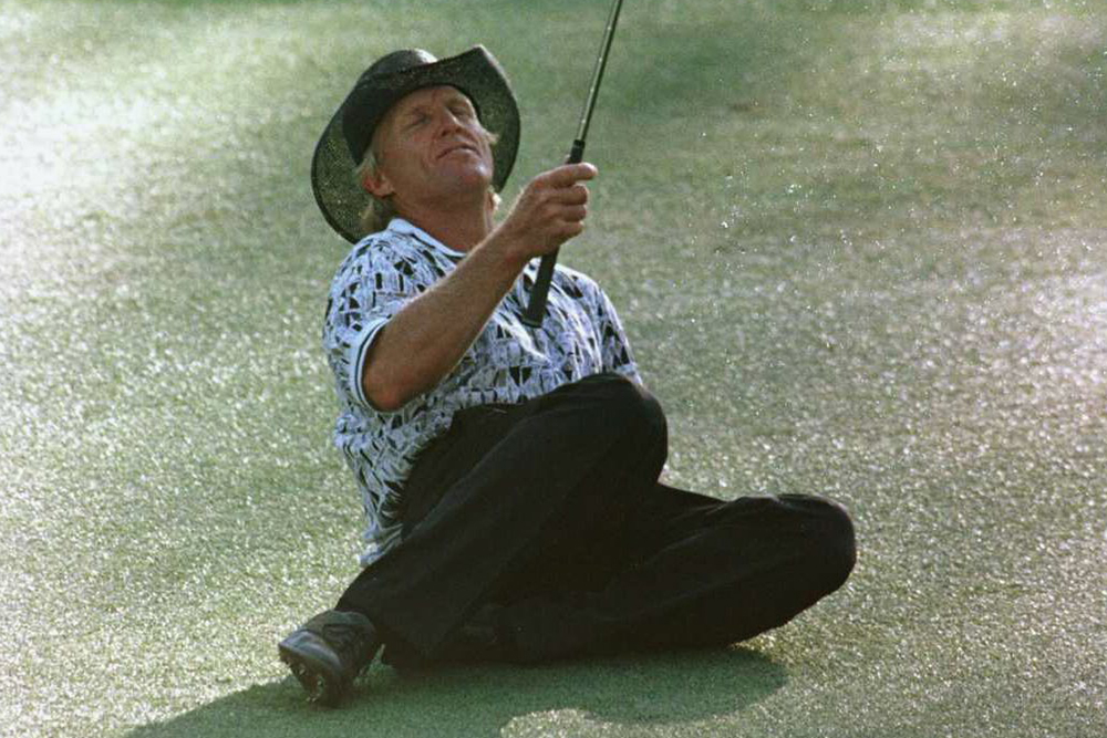 Greg Norman slumps to the ground at the 15th during the 1996 Masters (Getty Images)