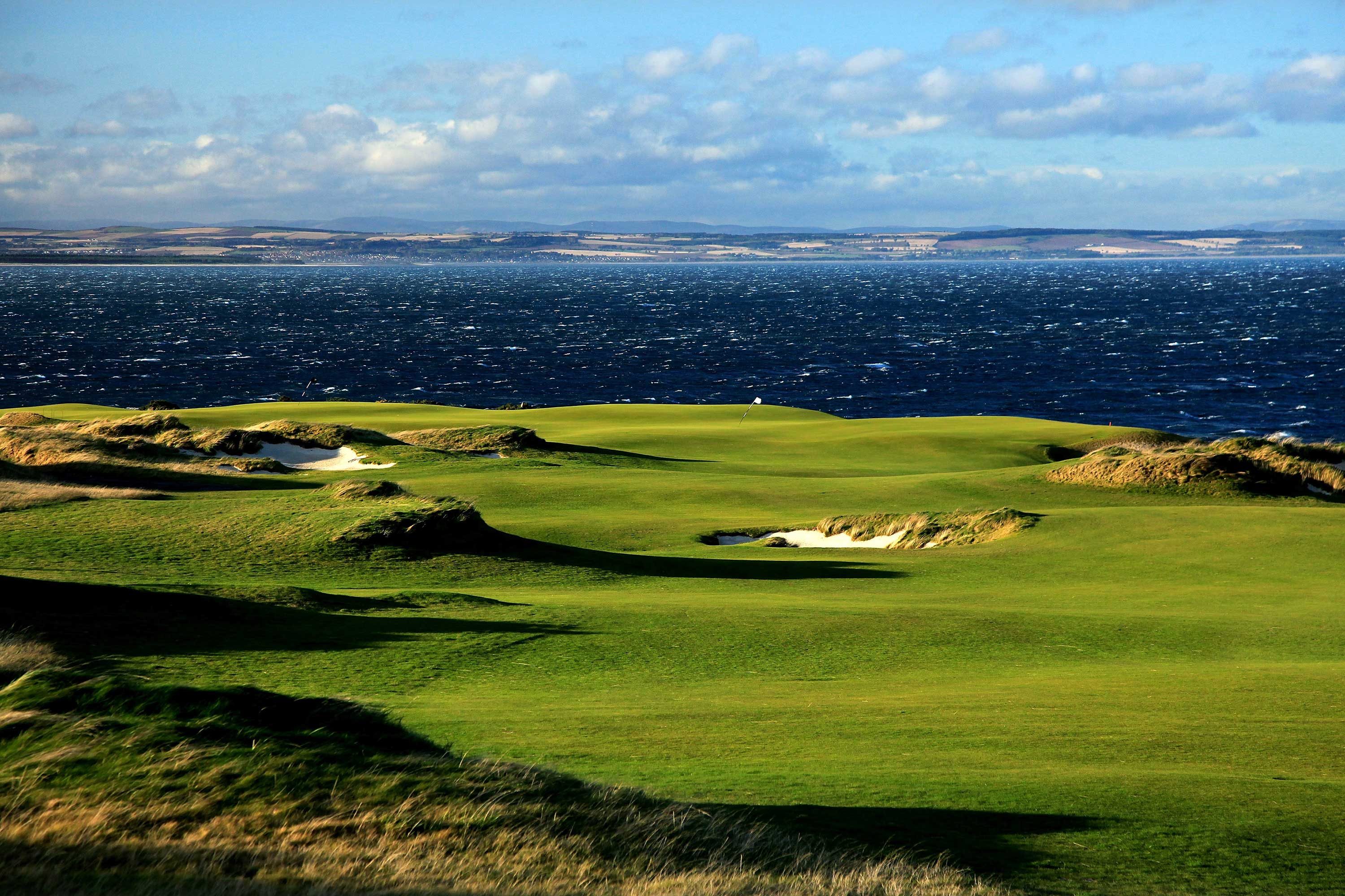 The par-five 18th on the Castle Course overlooks St Andrews Bay 