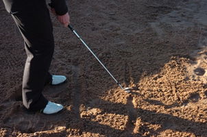 How to hit a downhill bunker shot