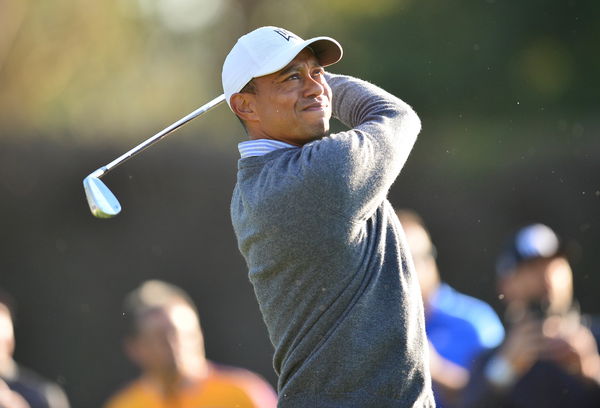 Tiger Woods goes FISHING for his golf ball in a trash can!