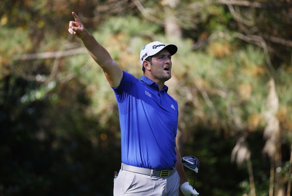 Jon Rahm follows DUFFED fairway wood with shot that hits the tree plum centre!