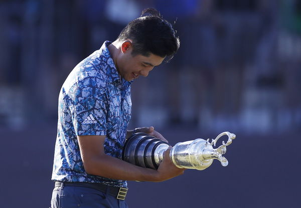 Open winner Collin Morikawa seen pulling CLARET JUG THROUGH AIRPORT on way home