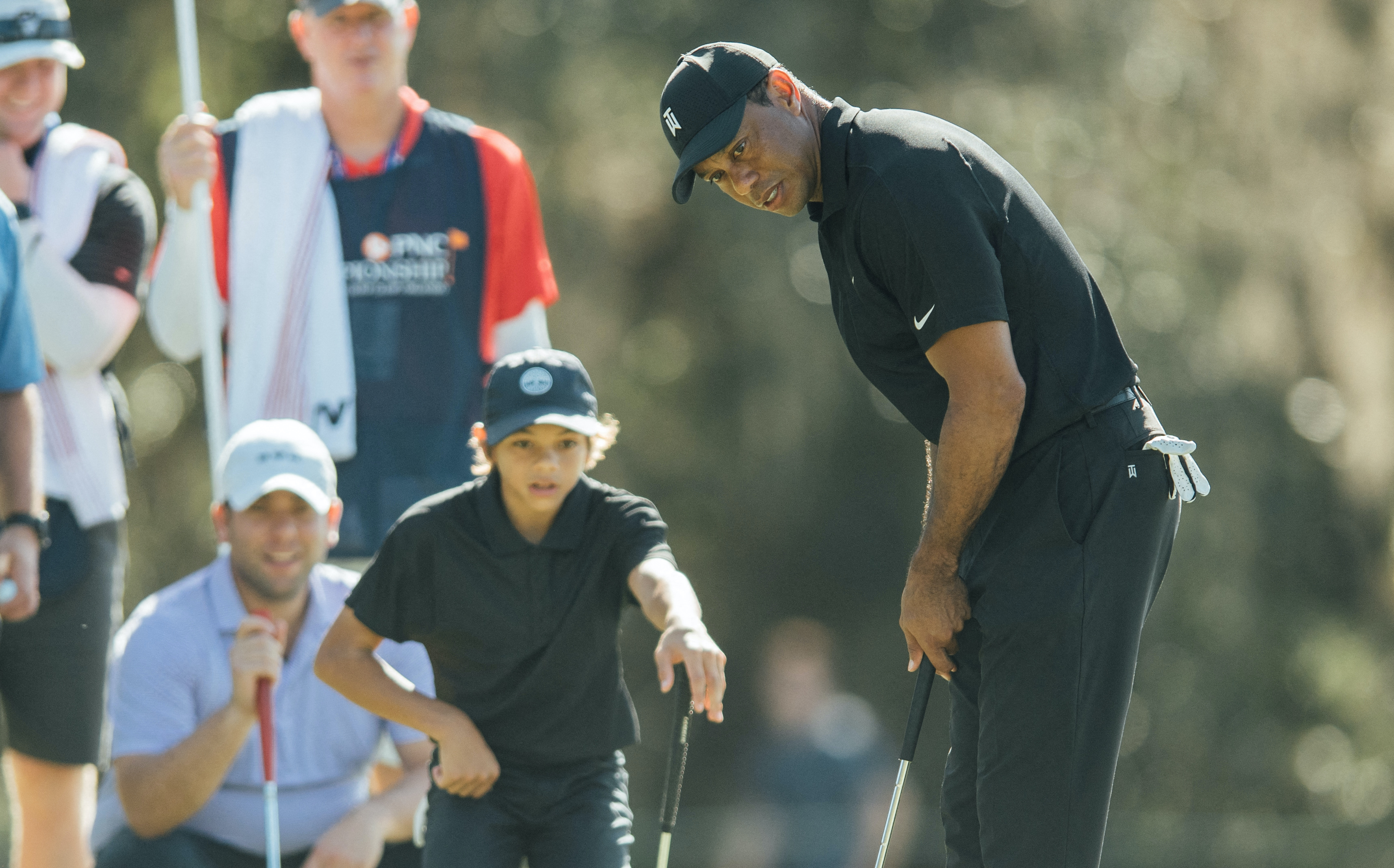 EXHAUSTED Tiger Woods watches son Charlie on driving range after Pro-Am round GolfMagic