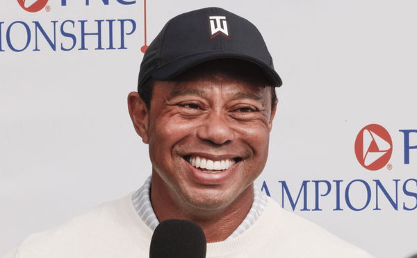 Tiger Woods chuckles to himself as he delivers Lionel Messi verdict