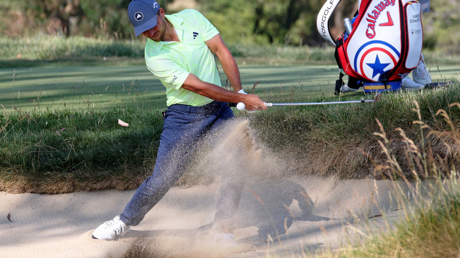 Watch Xander Schauffele take three (!) from a fairway bunker at the US Open