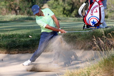 Watch Xander Schauffele take three (!) from a fairway bunker at the US Open