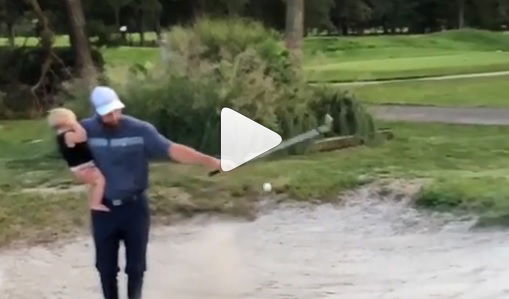WATCH: Dad shows how to golf and parent at the same time!
