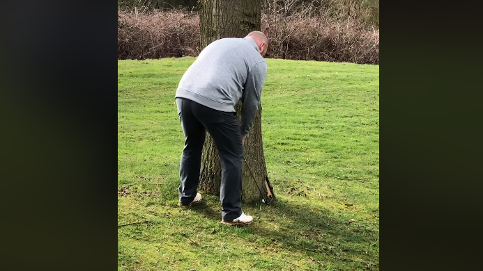 WATCH: Tree rebound golf shot goes HORRIBLY WRONG!