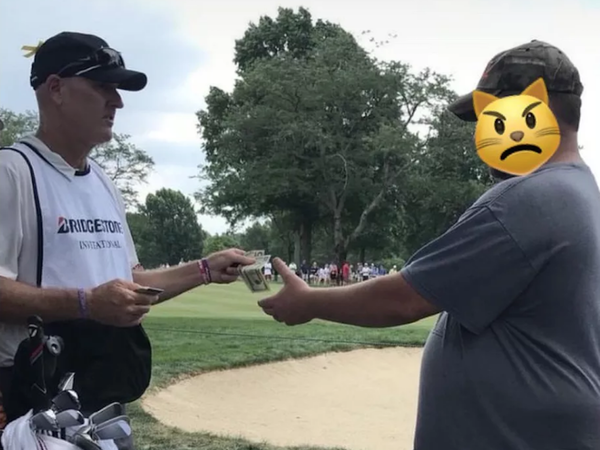 Tiger Woods’ caddie paid a heckler $25 to leave the WGC-Bridgestone!