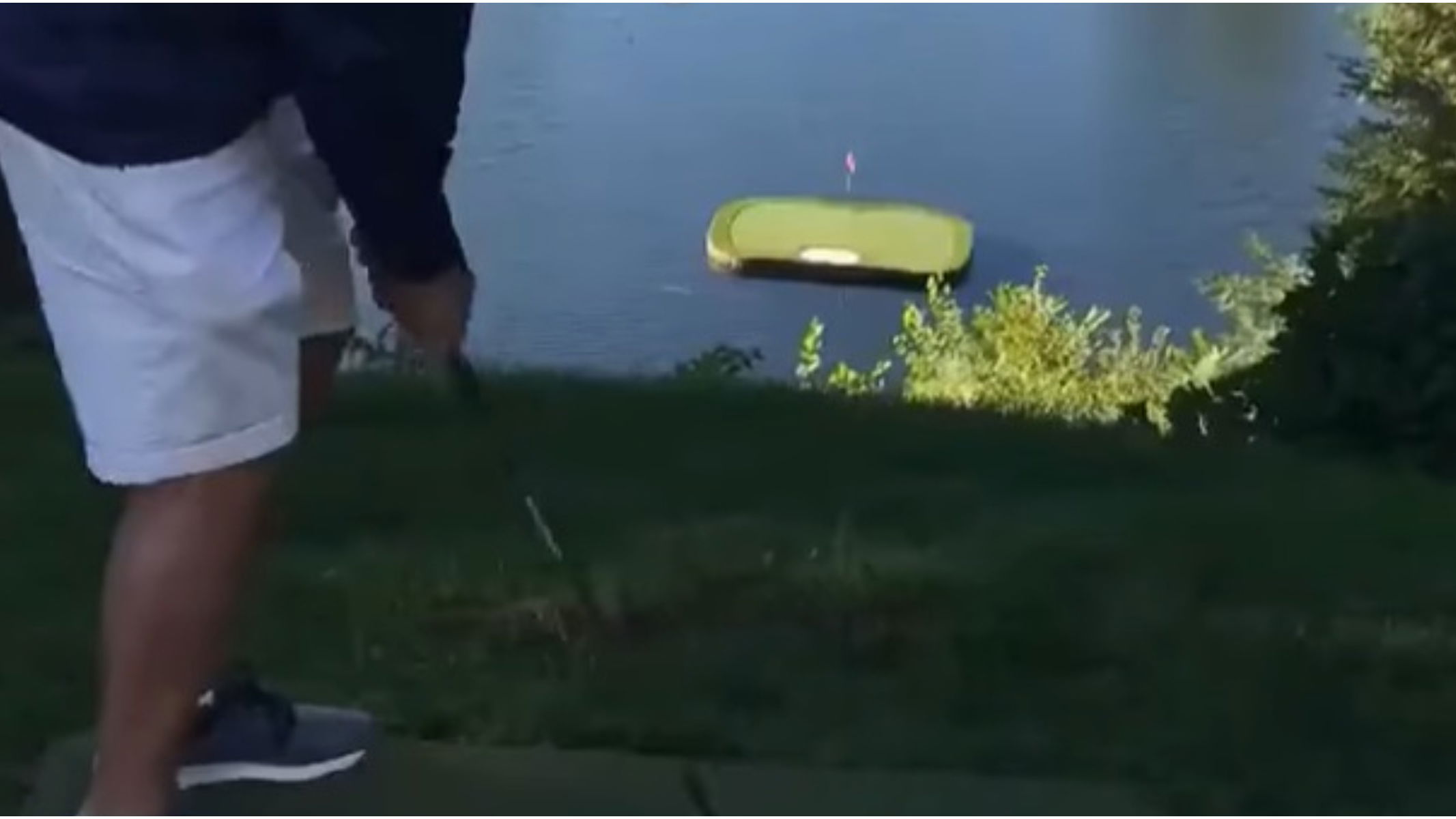 Golfer goes flag-hunting and STIFFS it to an inch on a green surrounded by lake