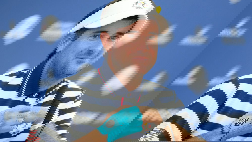 Bubba Watson wears blue glove during press conference at Ryder Cup