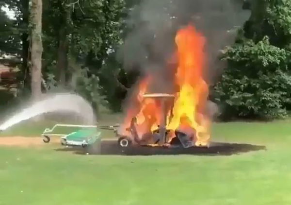 WATCH: Golfers try to put out HUGE golf buggy fire