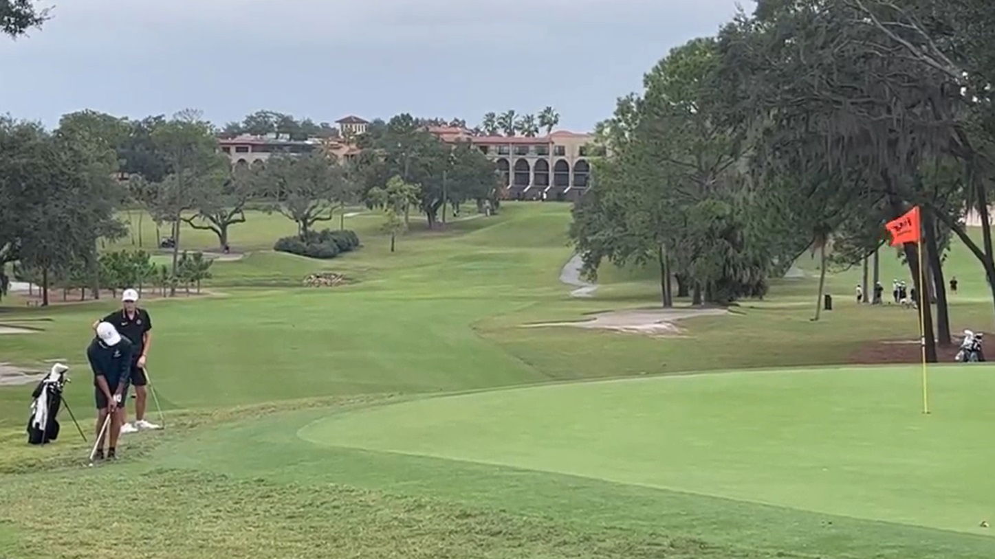 Charlie Woods gives epic fist pump with Tiger Woods on bag en route to team win