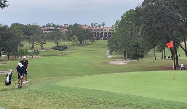 Charlie Woods gives epic fist pump with Tiger Woods on bag en route to team win