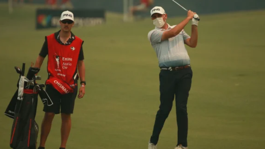 Tour pro borrows FACE MASK off golf fan to compete in Australian Open