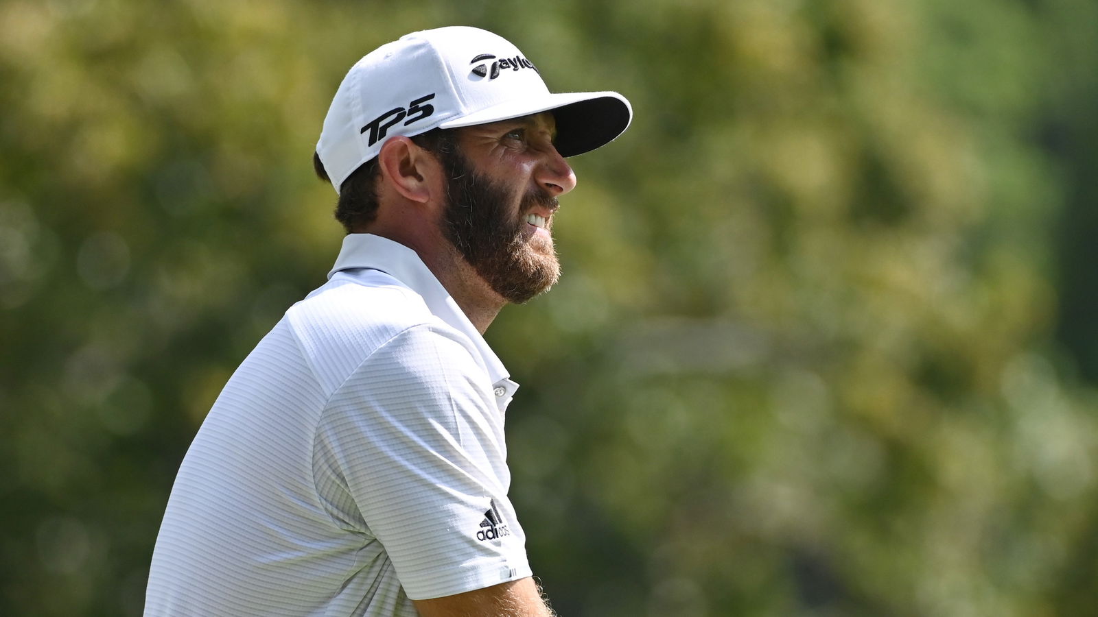 Dustin Johnson holds slender lead at Tour Championship