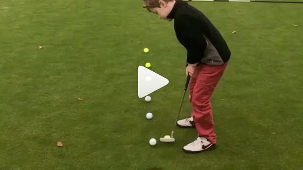 little lad shows off golf skills in cool putting drill